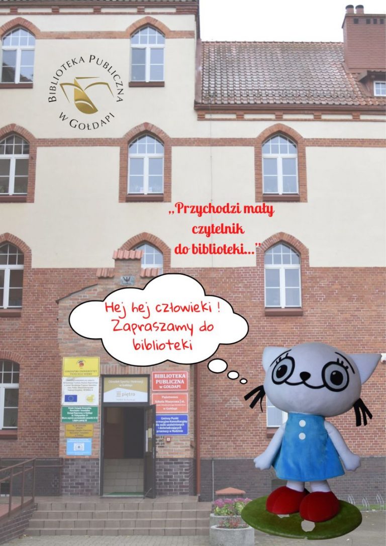 Budynek w którym znajduje się biblioteka i Kicia Kocia zapraszająca czytelników.