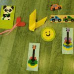 Zakładki do książek wykonane z koralików do prasowania oraz żółty ptaszek origami.